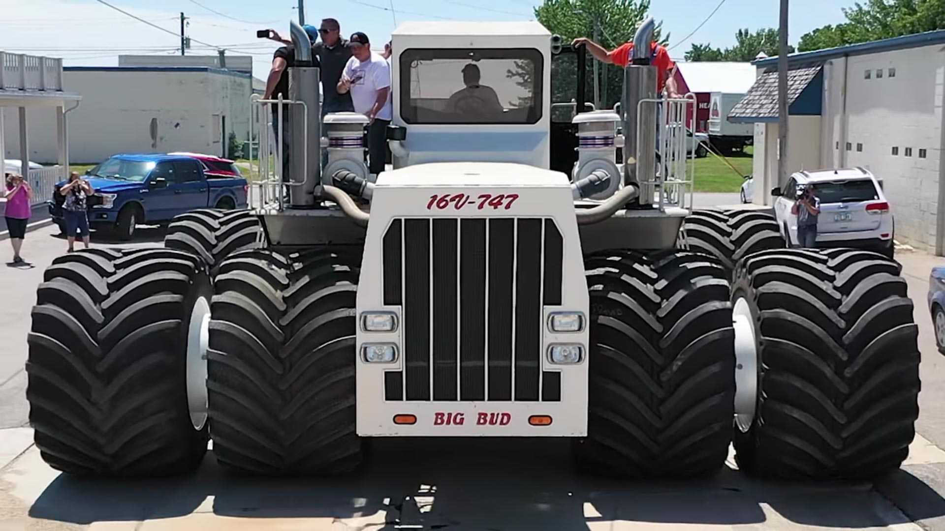 The world’s largest tractor tires on Big Bud Tractor driving down street