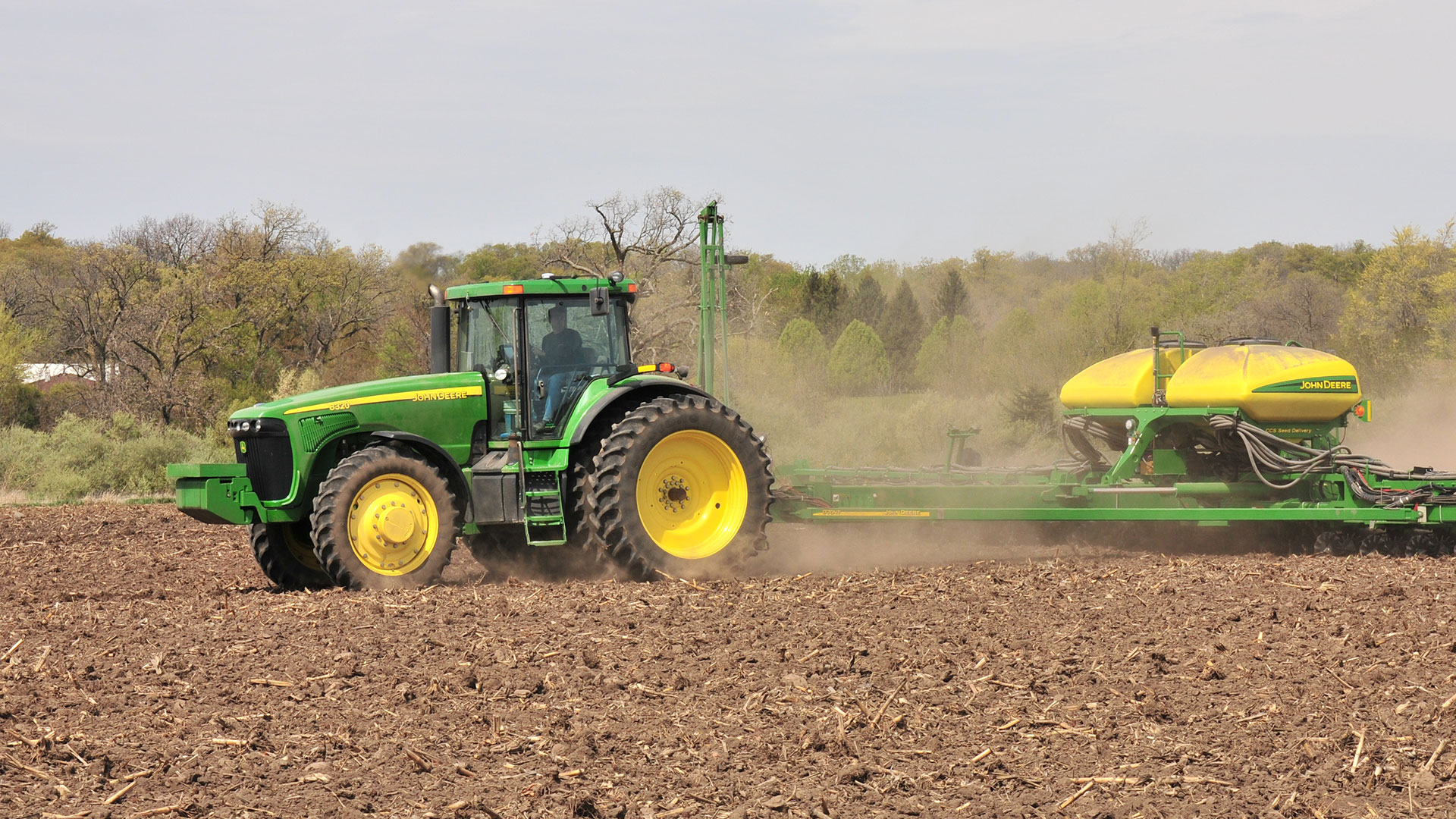 John Deere tractor equipped with LSW tires to reduce power hop and road lope